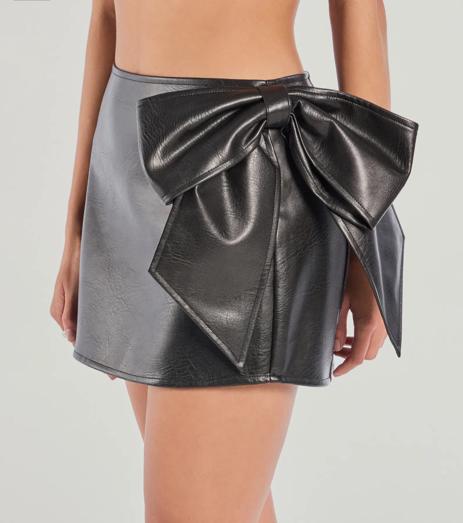 Leave An Impression Statement Bow Faux Leather Mini Skirt